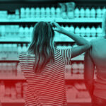Mother and children are choosing dairy products in shop